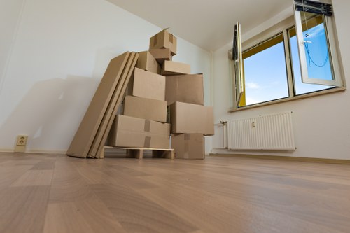 Removal team planning a move in Kingscross with boxes and furniture