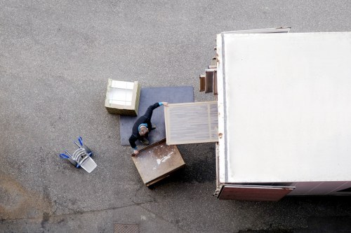 Household boxes and furniture being unloaded at a new Kingscross home