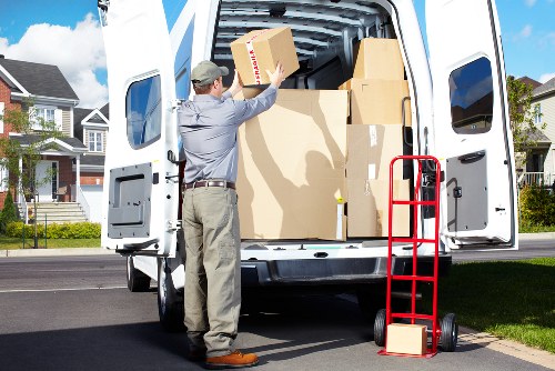 Specialist movers loading a piano securely for transport from Kingscross