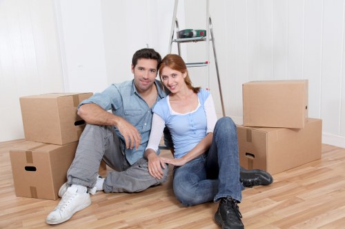 Local movers transporting furniture in an inner-city Kingscross street