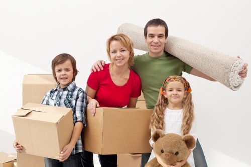 Professional office relocation team handling desks and equipment in a Kingscross building
